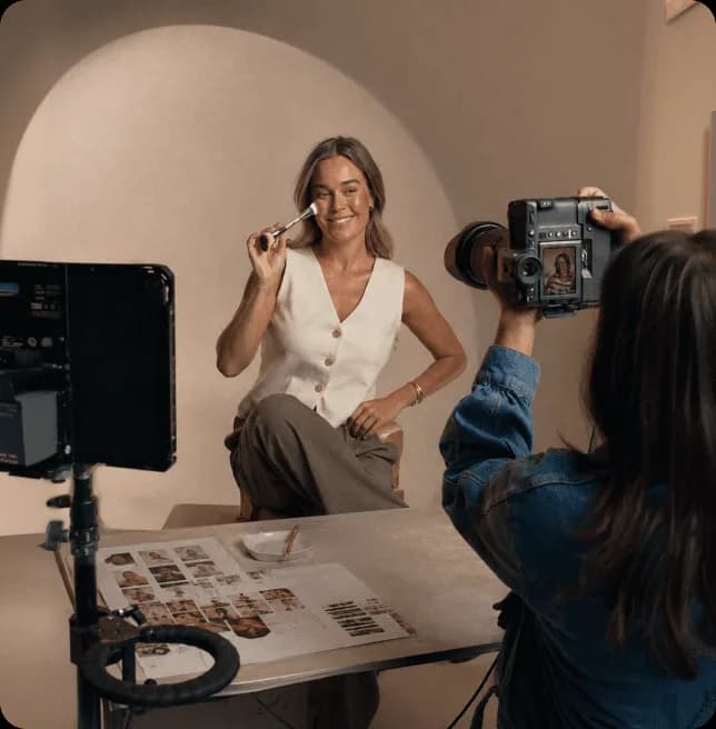 Content creator filming a beauty influencer during a professional social media shoot