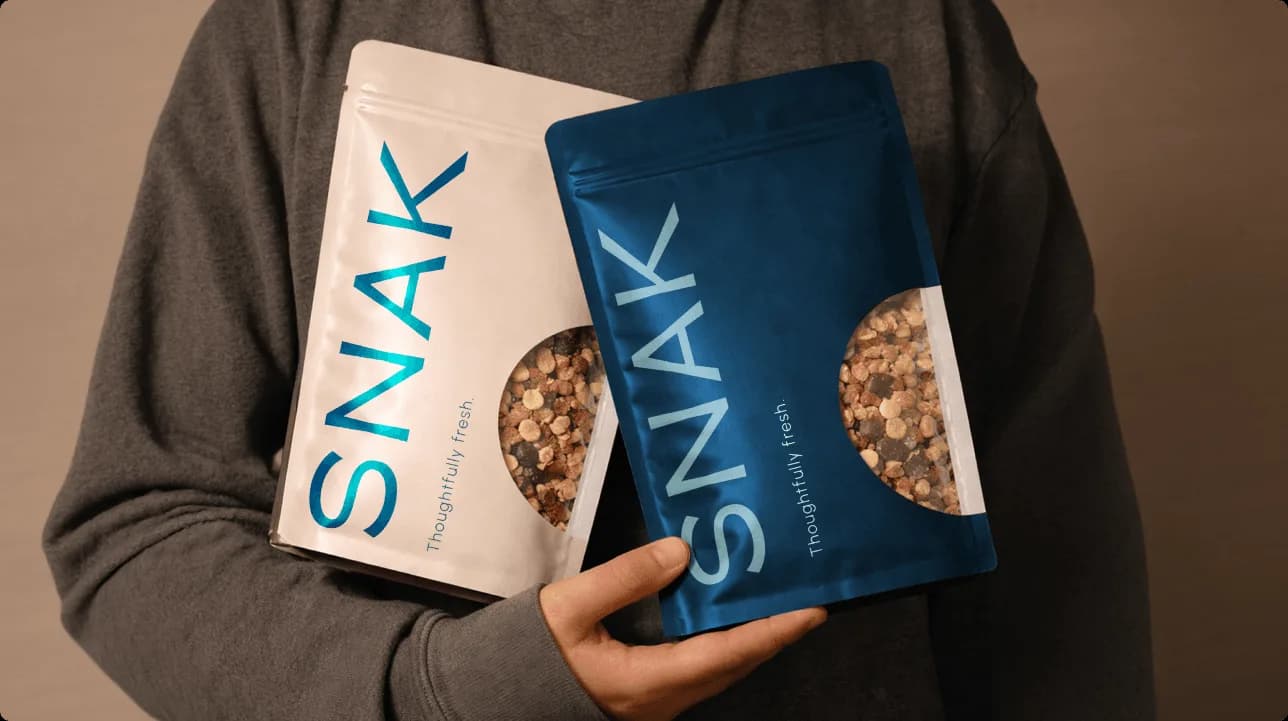 SNAK granola product photography highlighting premium packaging and breakfast positioning
