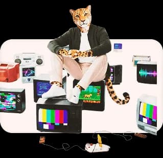 Leopard creative professional surrounded by multiple digital screens and media devices