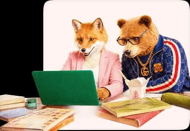 Fox and bear creative professionals reviewing work together on a laptop