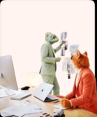 Chameleon presenting ideas on a wall while a cat creative professional takes notes