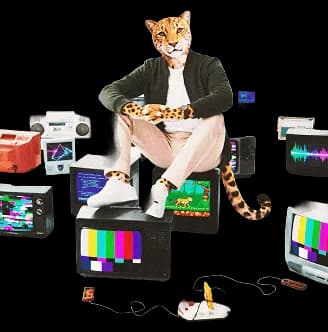 Leopard creative professional surrounded by multiple digital screens and media devices