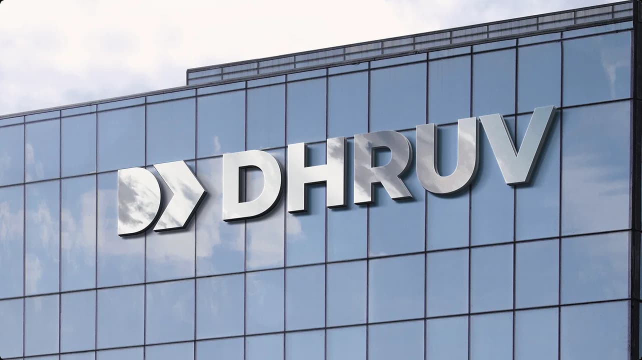 Dhruv Technology Solutions visual identity applied across branded event and communication materials